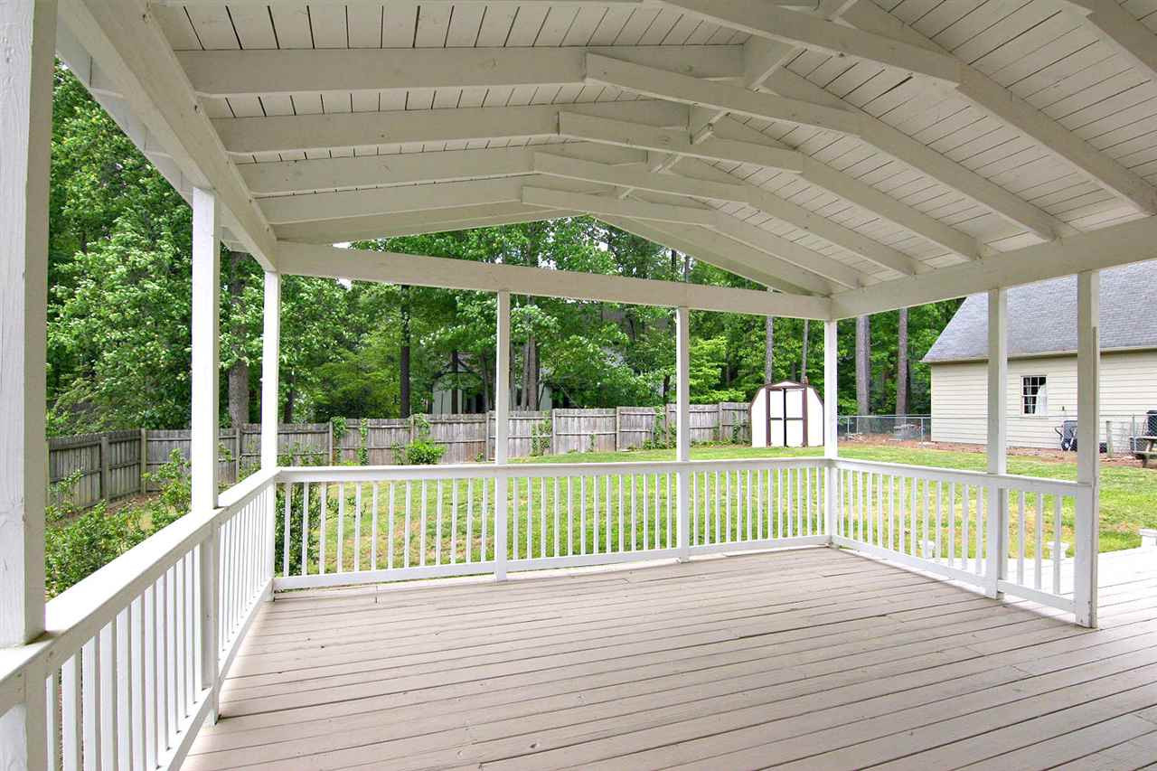 7801 Audubon Drive Raleigh, NC 27615 - Photo 24 of 25 Get Ready for Summer Entertainment on this Generously-sized Covered Porch that overlooks the Amazing Backyard Covered Porch