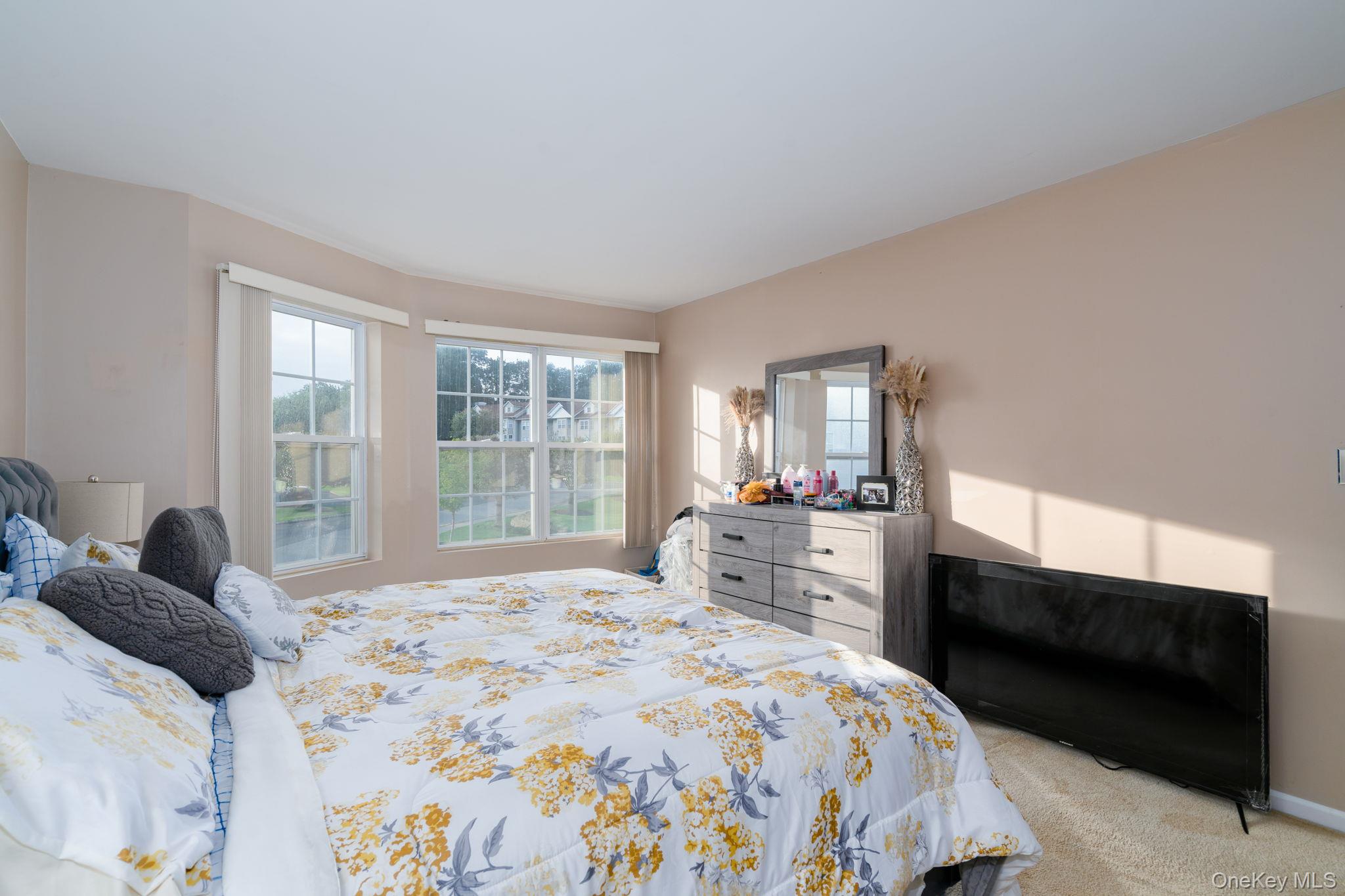 205 Ramapo Road, Unit H Garnerville, NY 10923 - Photo 14 of 31 a bedroom with a bed and a large window