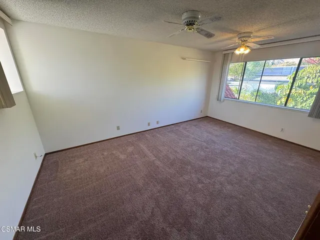 a bathroom with a sink a granite counter and shower