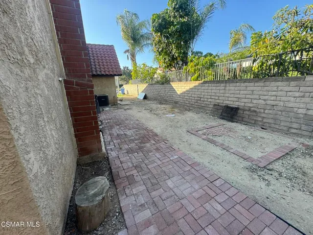 a view of a back yard of the house