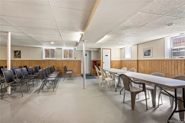 a dinning room with lots of furniture and wooden floor