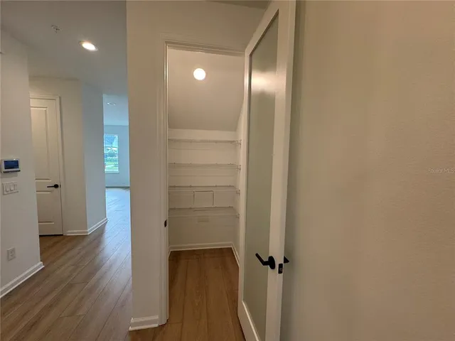 a view of a bathroom from a hallway