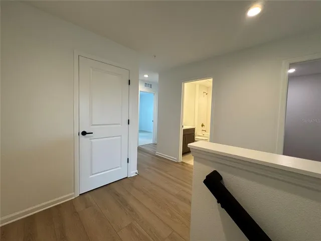 a view of gallery with wooden floor