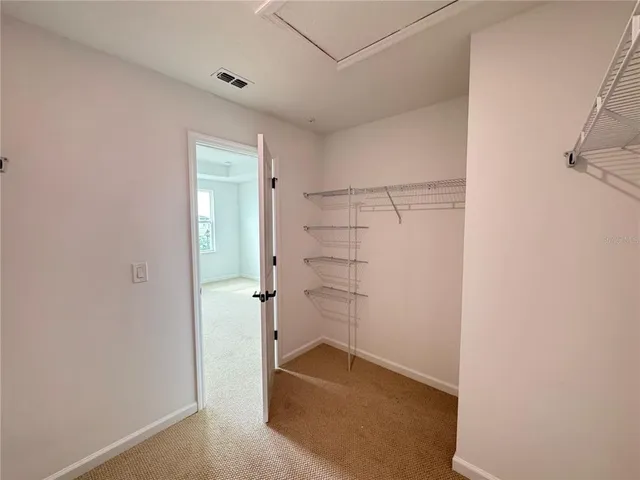 a view of a room with racks on the wall