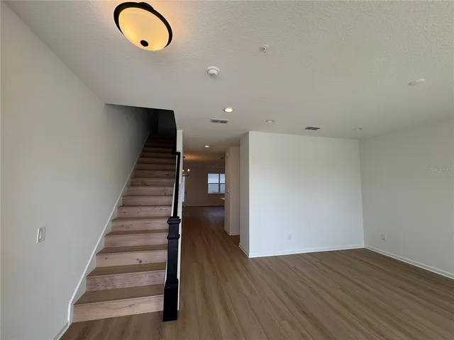 a view of a livingroom with wooden floor