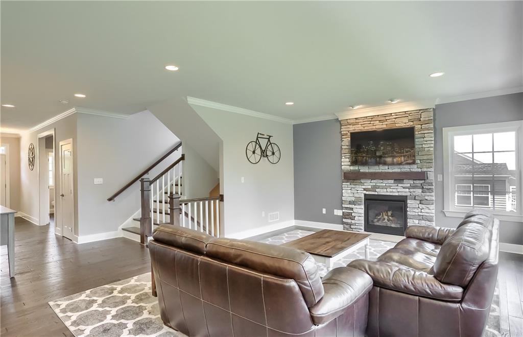 130 Vista Ridge Lane Valencia, PA 16059 - Photo 13 of 25 A floor to ceiling stone fireplace warms the space on cool evenings.