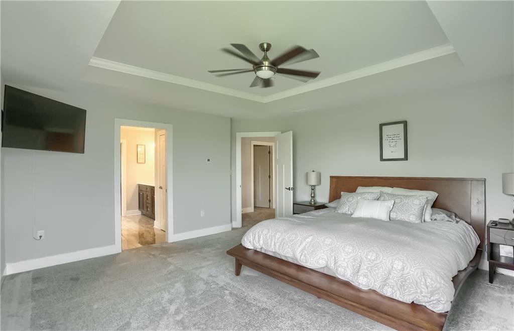 130 Vista Ridge Lane Valencia, PA 16059 - Photo 16 of 25 The master bedroom has a trey ceiling, neutral tone, plush carpeting, generous windows, and a private bath.