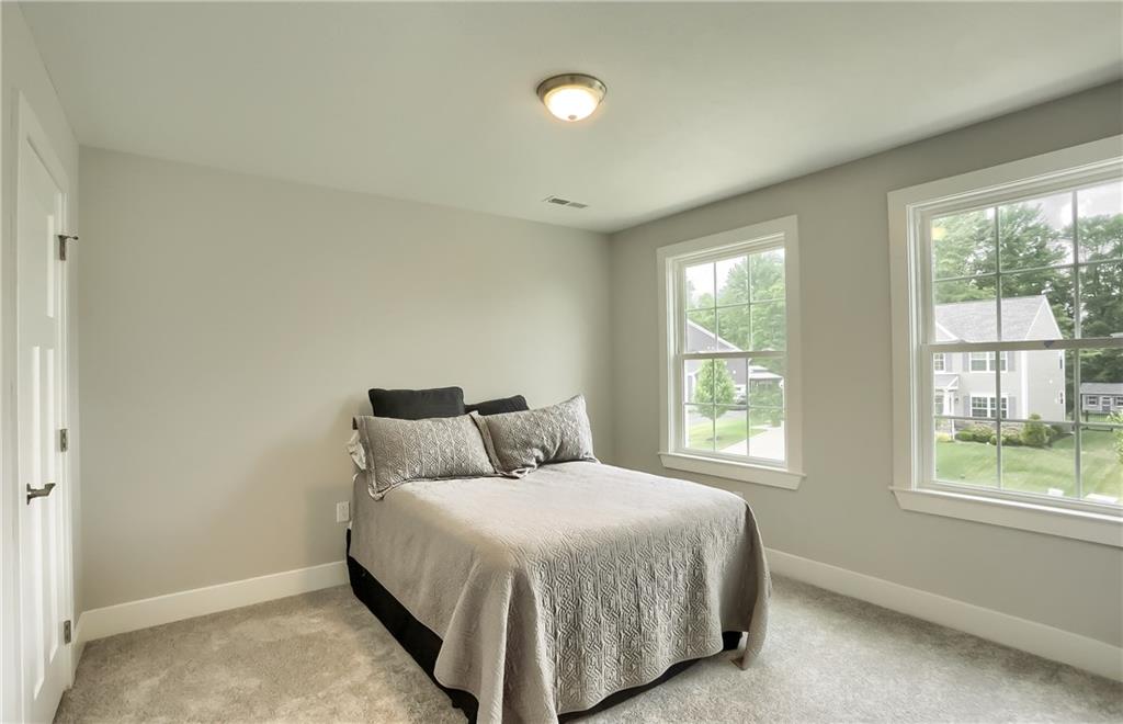 130 Vista Ridge Lane Valencia, PA 16059 - Photo 20 of 25 A second guest bedroom has sun-filled windows and neutral carpet.