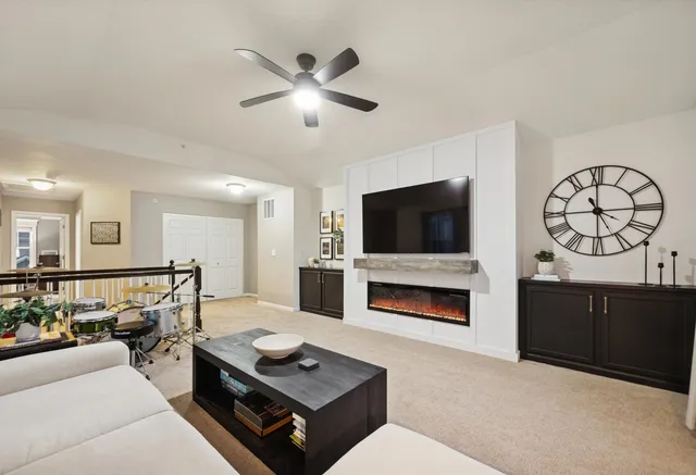 a bedroom with a bed gym equipment and a chandelier