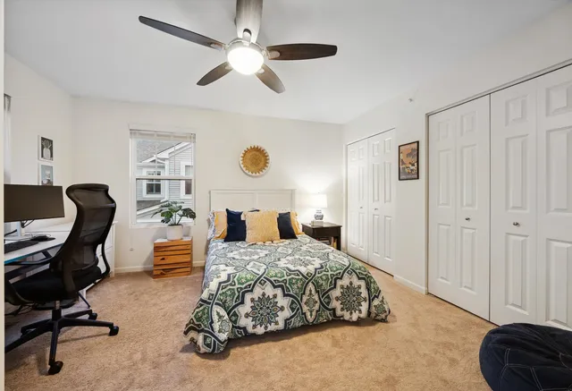 a swimming pool view with a seating space