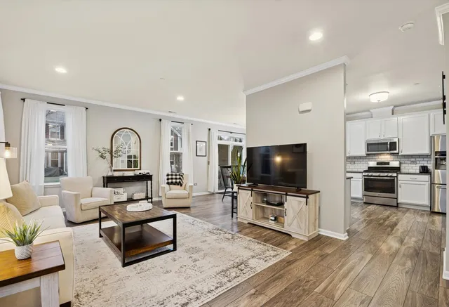 a living room with furniture and a window