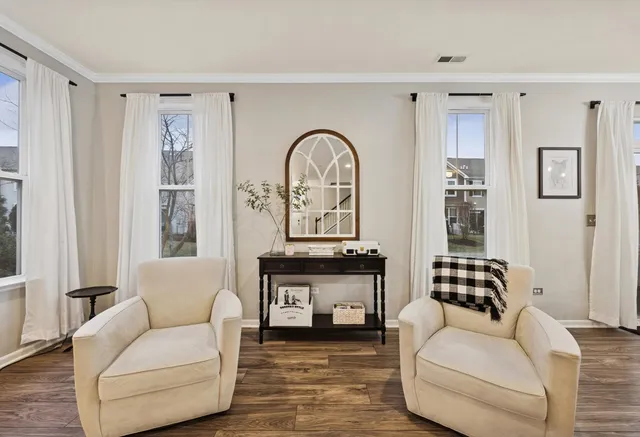 a view of a dining room with furniture and wooden floor