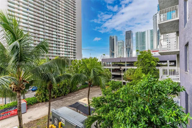 a view of a building with garden and plants