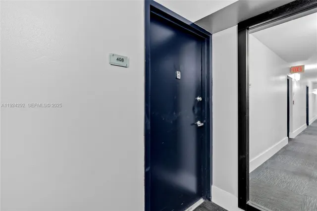 a view of hallway with wooden floor