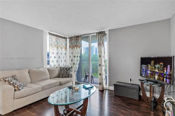a living room with furniture and a window