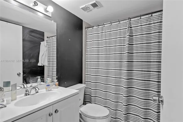 a view of hallway with a large mirror
