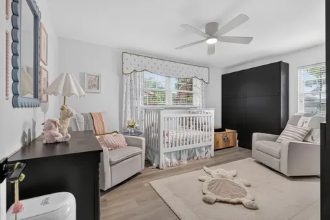 a bedroom with furniture and a window