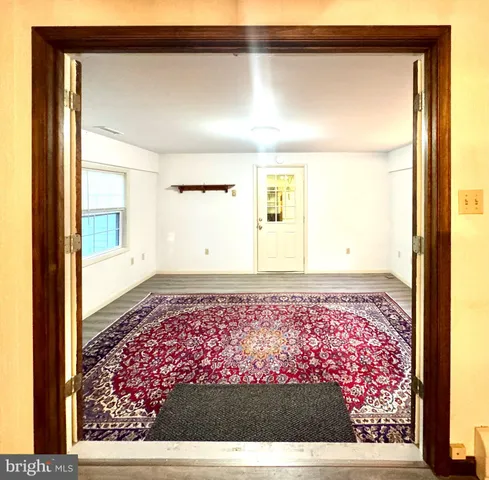a bedroom with a bed and flat screen tv