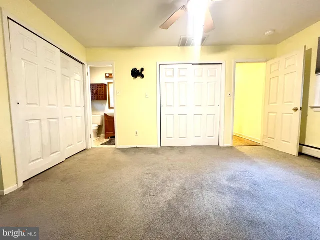 a bathroom with a toilet and shower