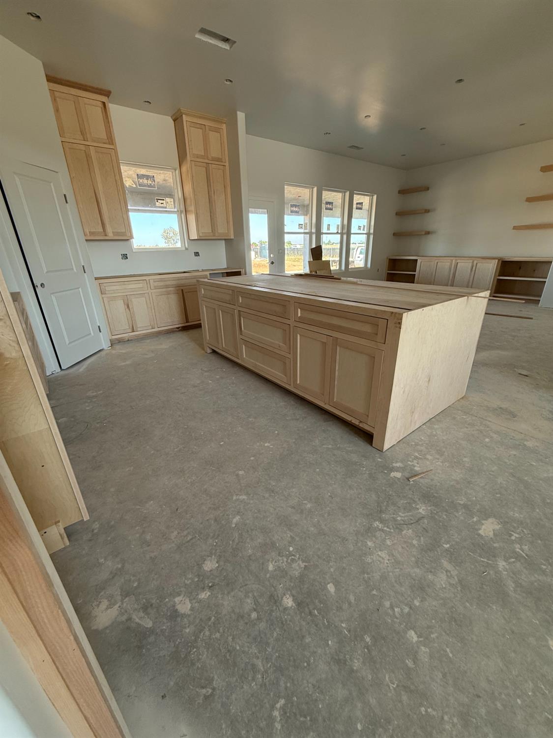 21250 Del Monte Road Madera, CA 93638 - Photo 11 of 17 a large white kitchen with a large window