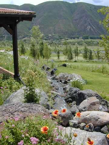 7 Arbaney Ranch Road, Unit 1/4 INTEREST Basalt, CO 81621 - Photo 2 of 3 a view of a garden with a bench