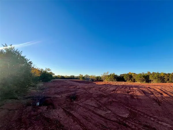 a view of a lake with a yard