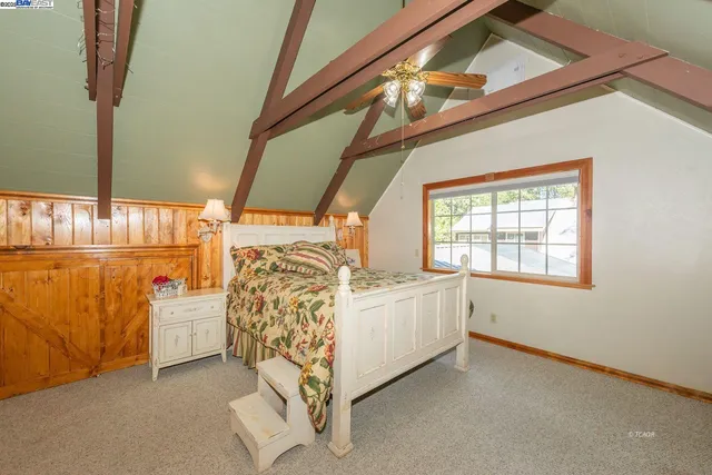 a bed room with a bed and a window