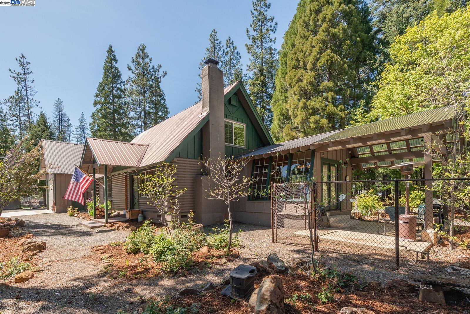 21 Cedar Road Trinity Center, CA 96091 - Photo 30 of 50 a view of a house with a tree in the background