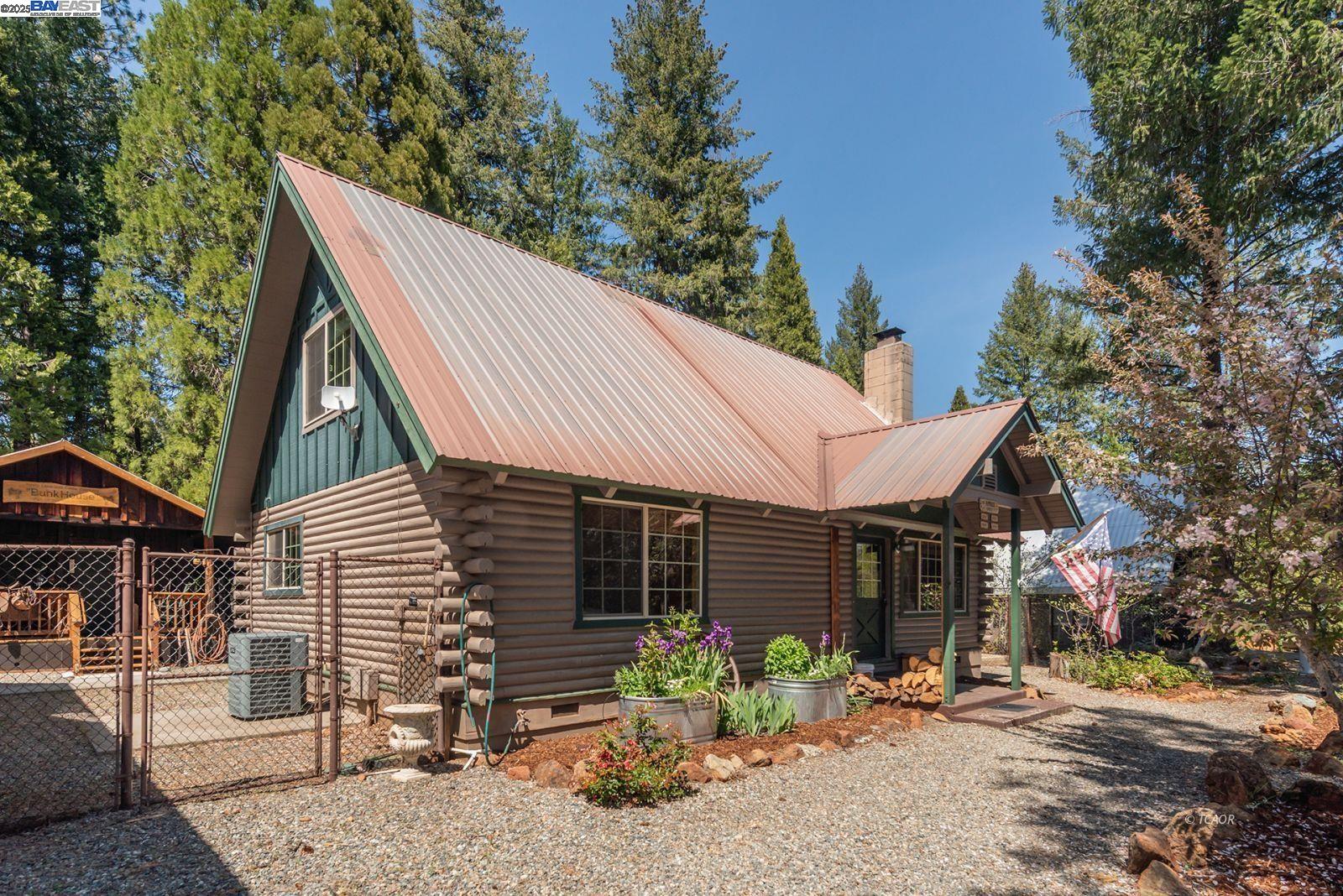 21 Cedar Road Trinity Center, CA 96091 - Photo 32 of 50 a backyard of a house with table and chairs