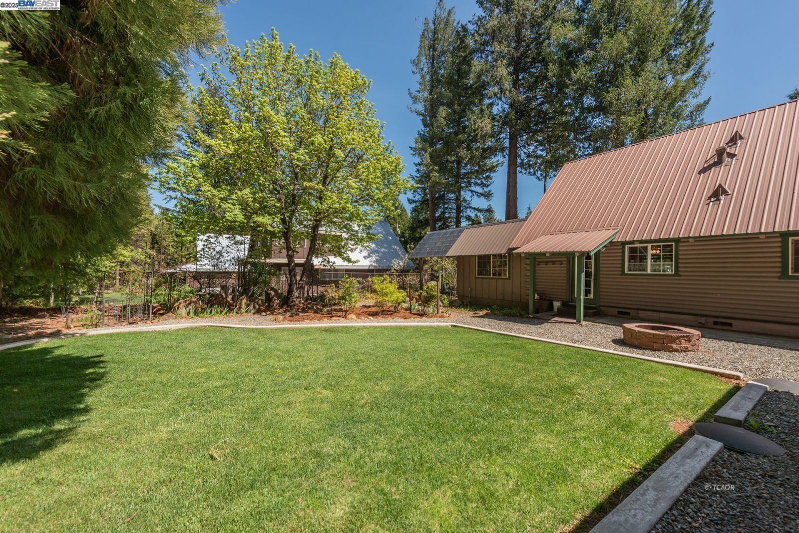 21 Cedar Road Trinity Center, CA 96091 - Photo 44 of 50 a view of a house with swimming pool and sitting area