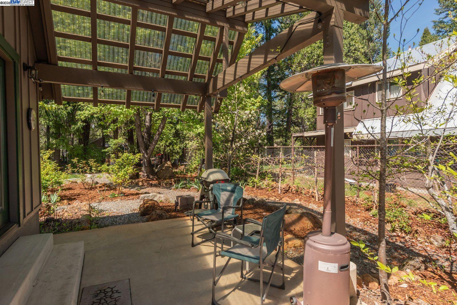21 Cedar Road Trinity Center, CA 96091 - Photo 46 of 50 a view of a patio with table and chairs and potted plants