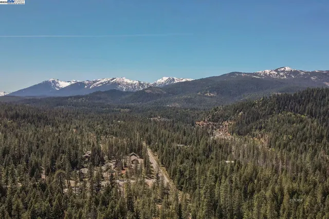 a view of a house with a mountain in the background