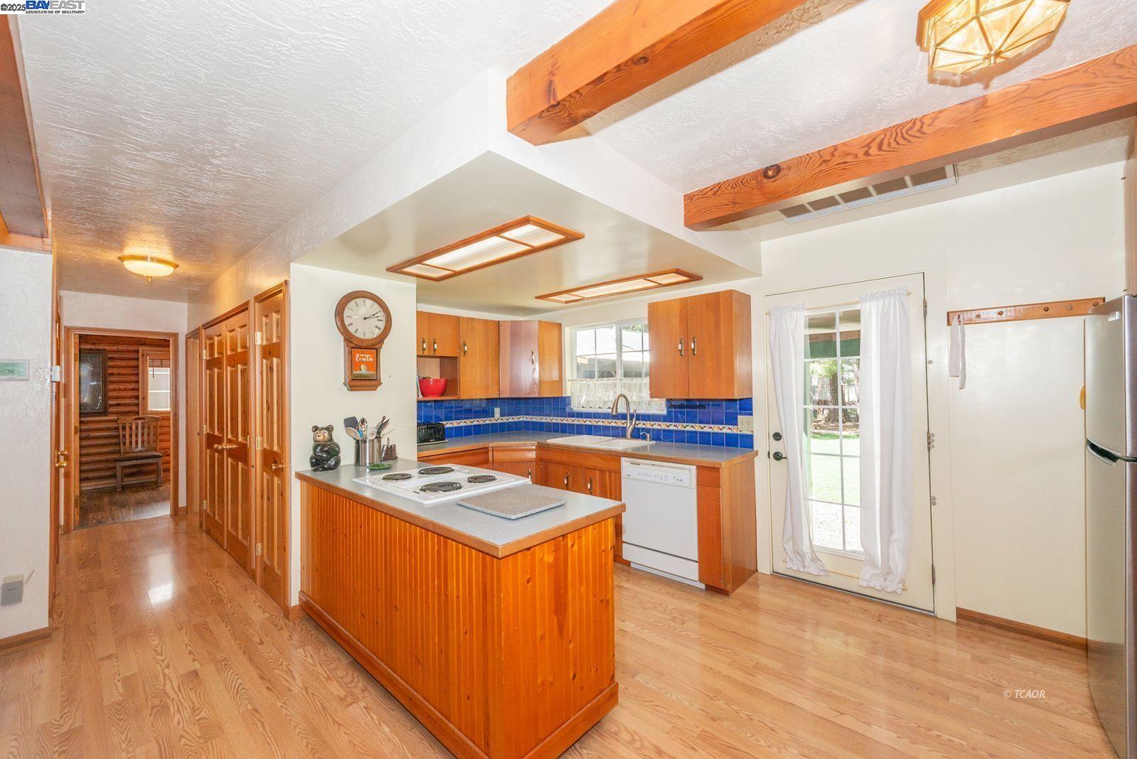 21 Cedar Road Trinity Center, CA 96091 - Photo 6 of 50 a kitchen with stainless steel appliances granite countertop a stove and a refrigerator