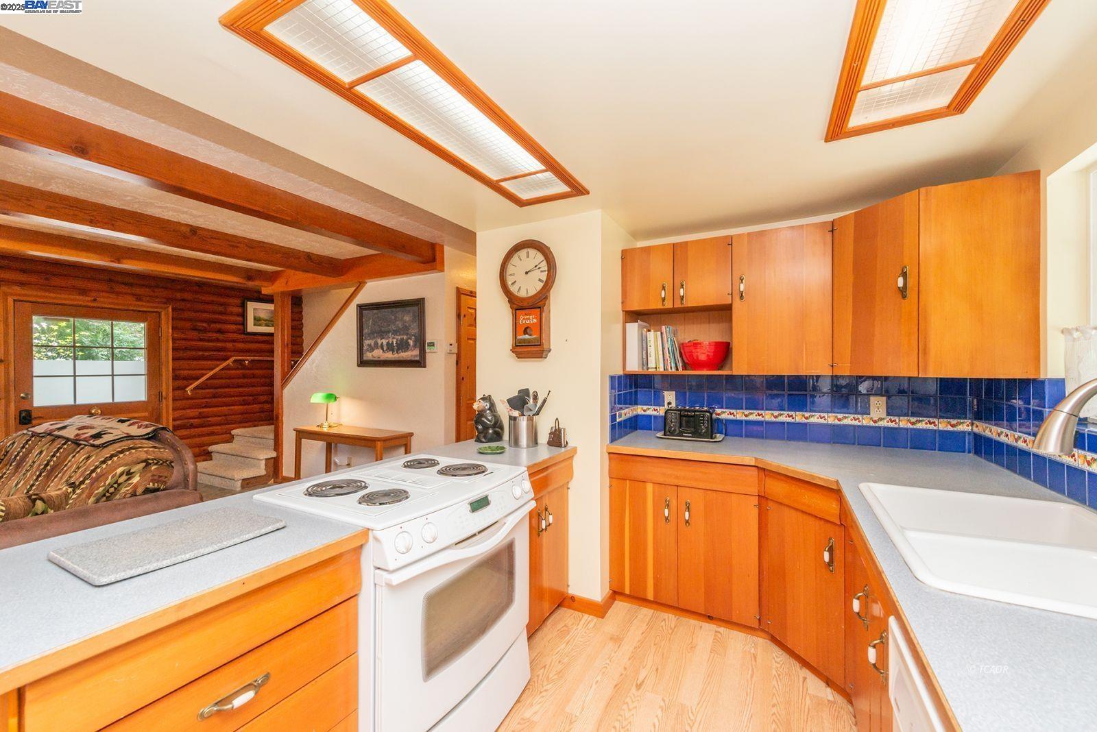21 Cedar Road Trinity Center, CA 96091 - Photo 7 of 50 a kitchen with a sink stove and cabinets