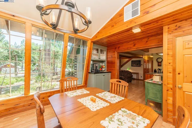 a bedroom with furniture and a large window