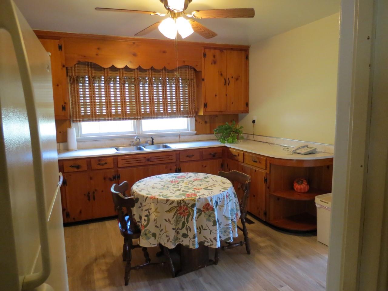 6280 Courthouse Road Louisa, VA 23093 - Photo 17 of 43 a bedroom with a bed and a chandelier