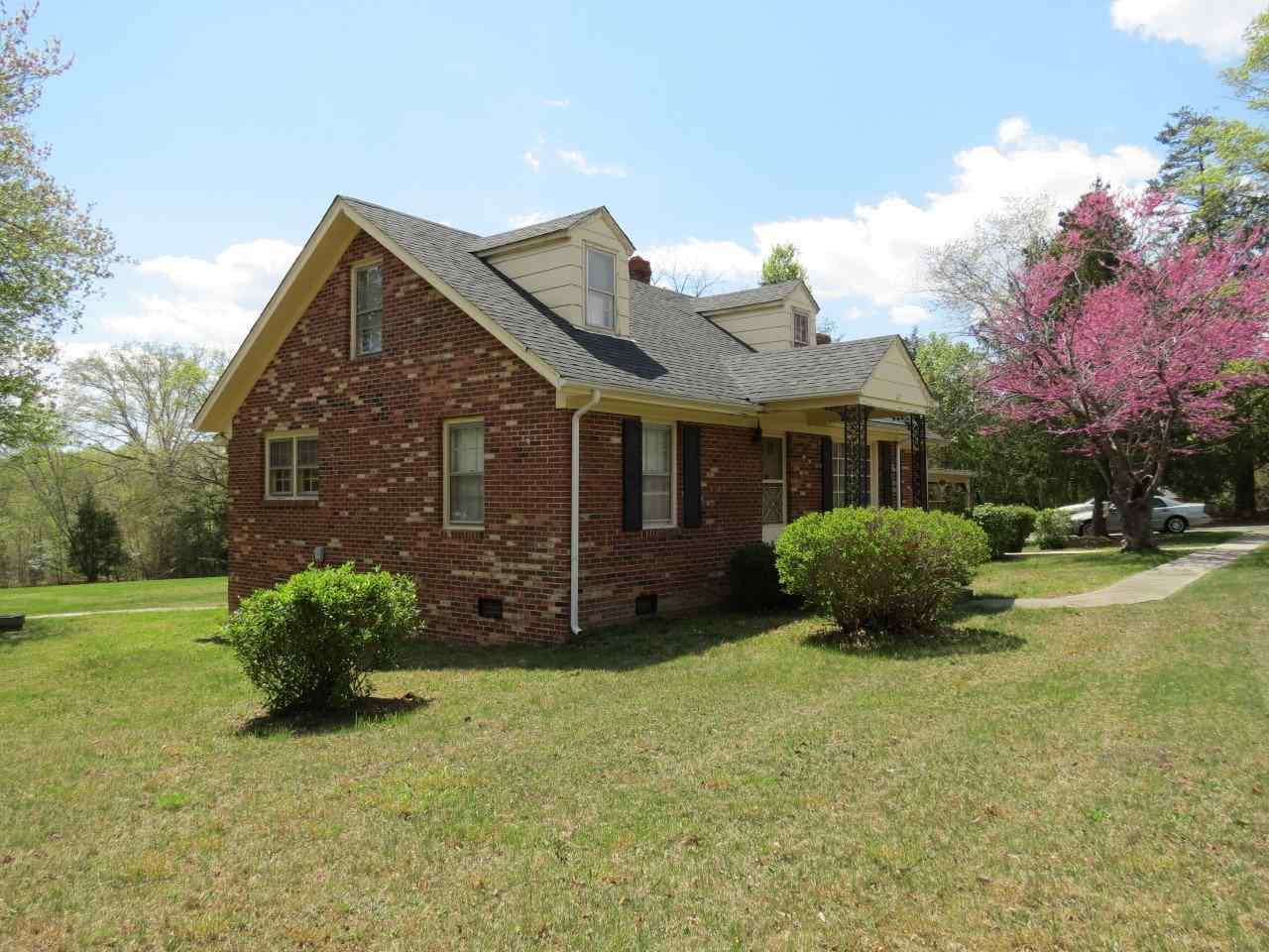 6280 Courthouse Road Louisa, VA 23093 - Photo 40 of 43 a view of a house with a yard and a garden
