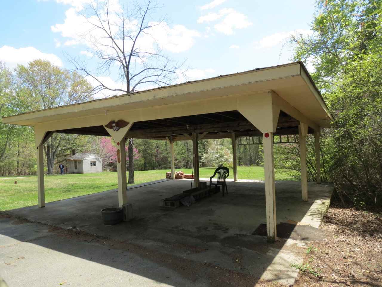 6280 Courthouse Road Louisa, VA 23093 - Photo 5 of 43 a backyard of a house with table and chairs