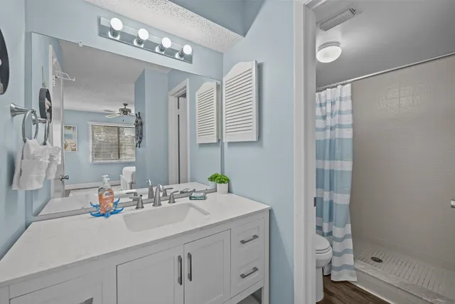 a bathroom with a sink double vanity and a mirror