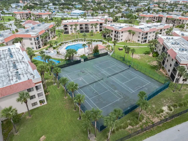 a view of a swimming pool with a yard