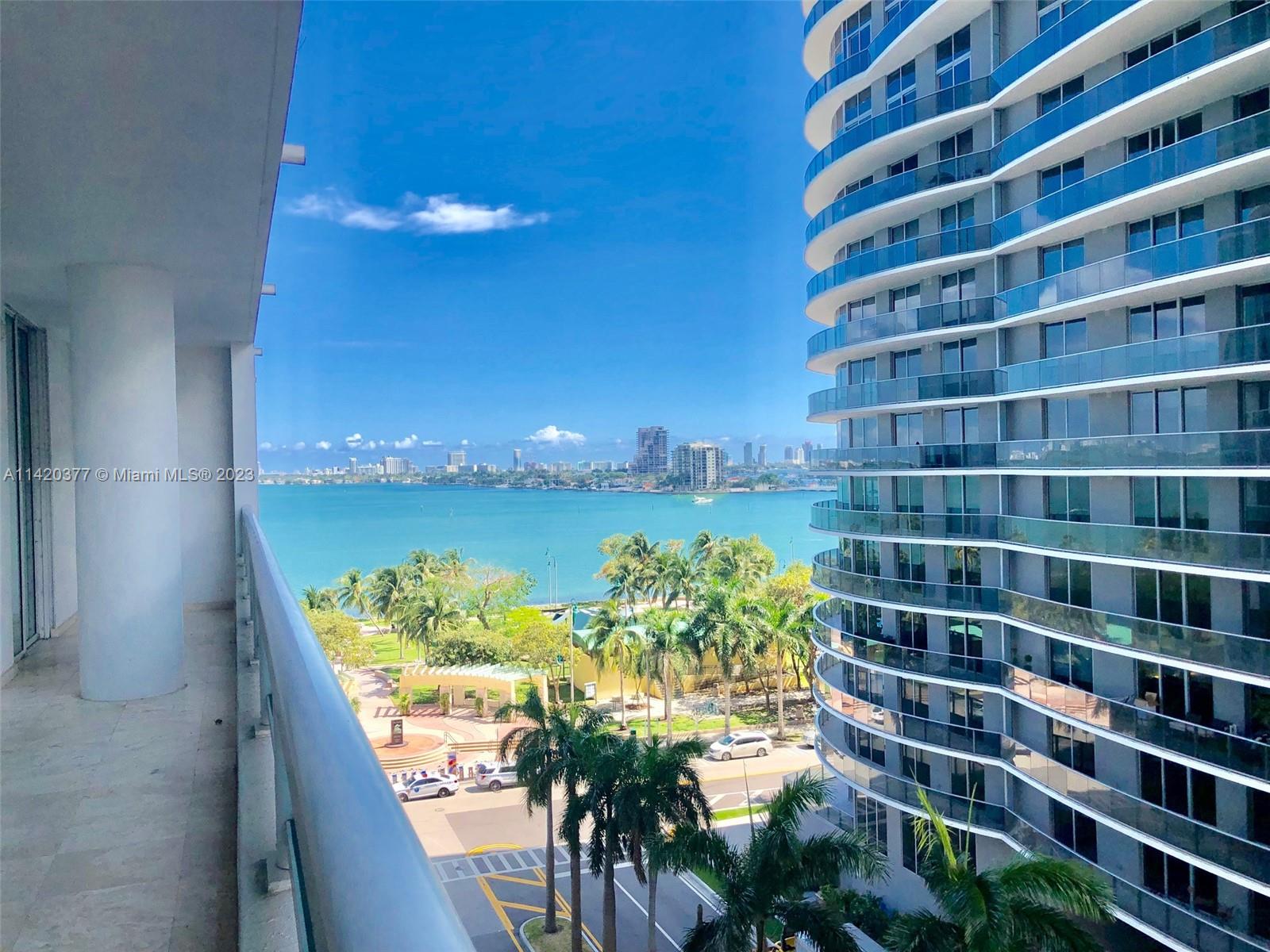 a view of a tall building from a balcony