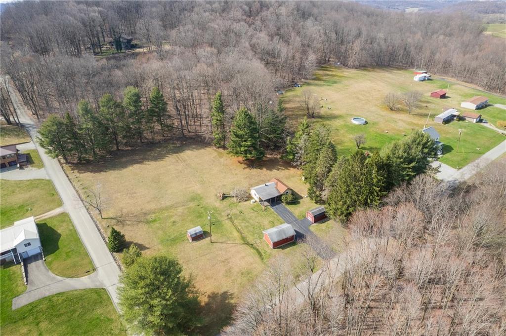 225 Pine Slopes Road Acme, PA 15610 - Photo 2 of 24 a view of backyard with swimming pool