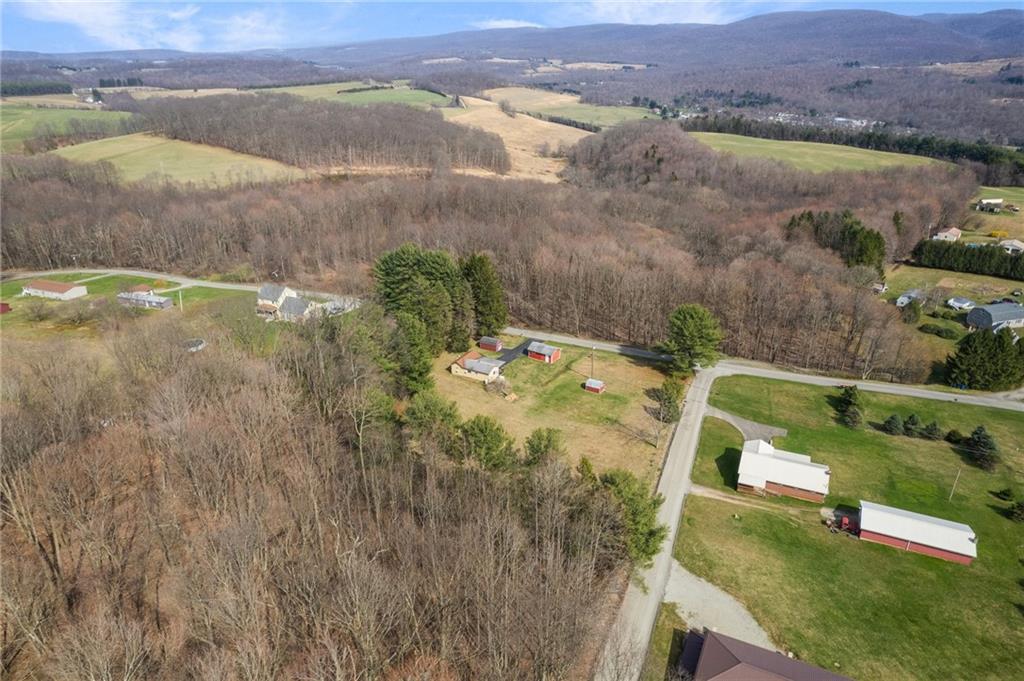 225 Pine Slopes Road Acme, PA 15610 - Photo 4 of 24 an aerial view of residential houses with outdoor space