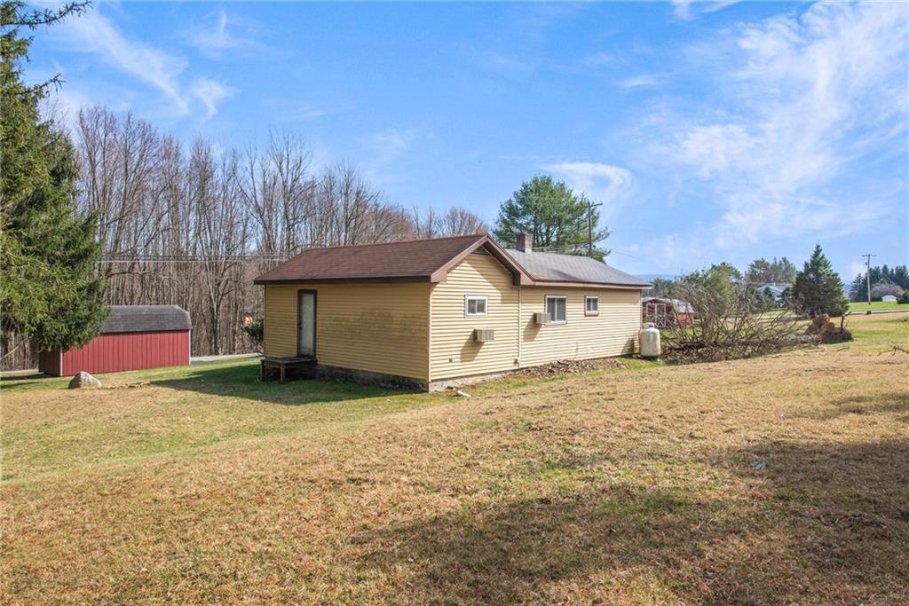 225 Pine Slopes Road Acme, PA 15610 - Photo 7 of 24 a view of a house with a yard