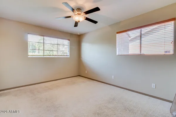 a bathroom with a sink toilet a mirror and shower