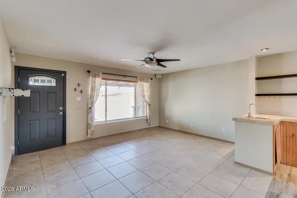 a kitchen with a sink cabinets and window