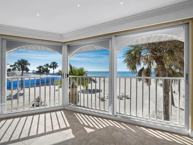 a view of a porch with a floor to ceiling window