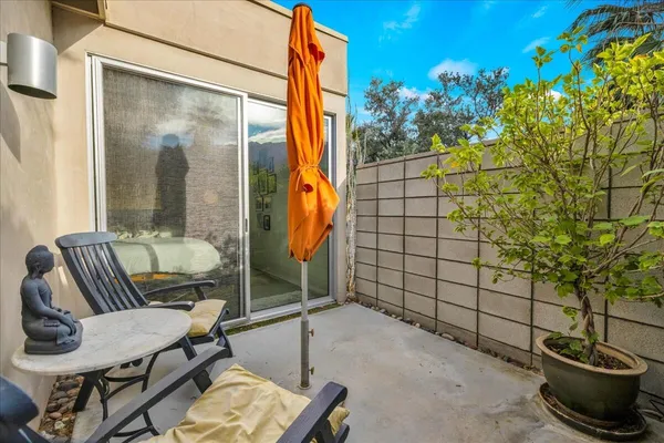 a view of a swimming pool with an outdoor seating