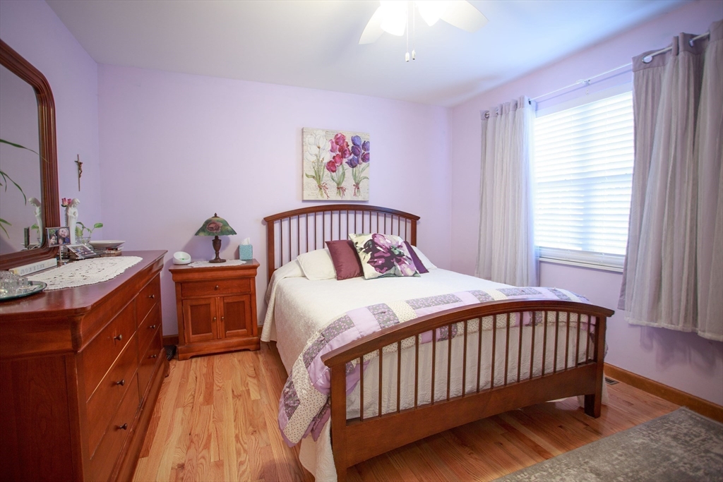 665 Center Street, Unit 311 Ludlow, MA 01056 - Photo 17 of 24 a bedroom with a bed and a window