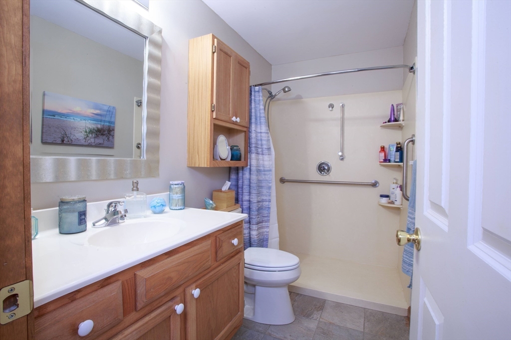665 Center Street, Unit 311 Ludlow, MA 01056 - Photo 20 of 24 a bathroom with a sink toilet and shower